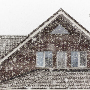 There is heavy snow outside the window.